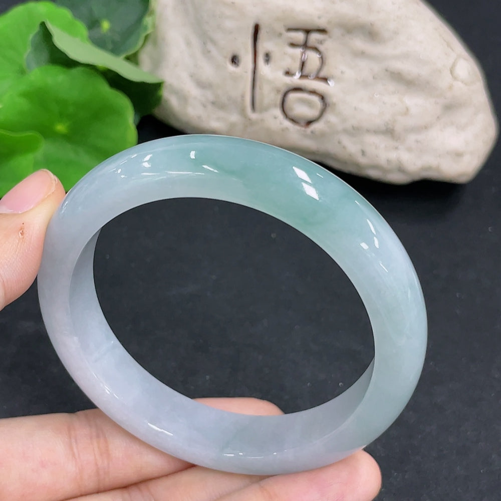 Round jadeite bracelet with a 58.3mm size, weighing approximately 63.2g, featuring smooth, polished green jade beads.