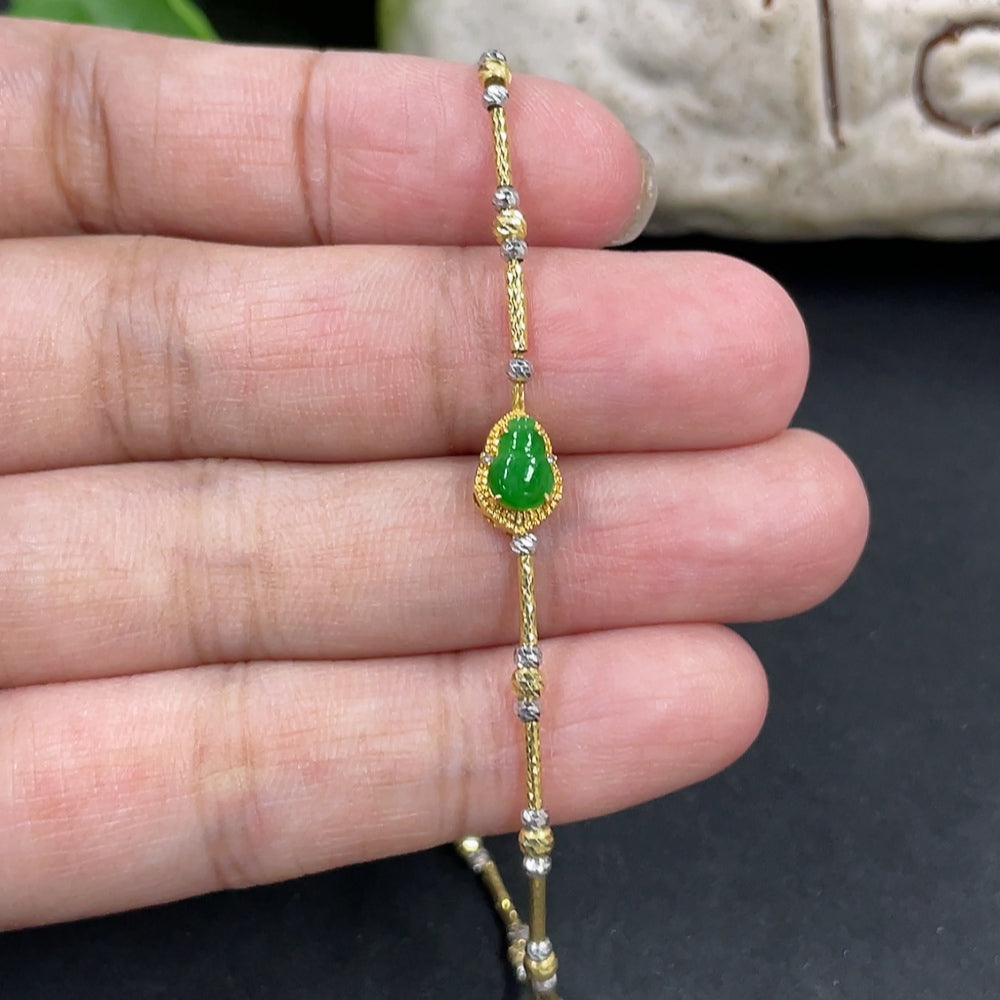 Jadeite gourd bracelet with 18k gold inlay and diamond accents, showcasing intricate craftsmanship and elegant design.