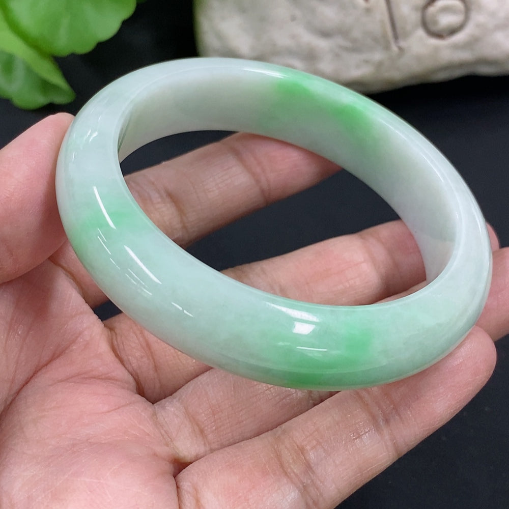HKHQ jadeite round bangle with size 53.8 and weight 56.6g, showcasing smooth polished jadeite surface and circular shape.