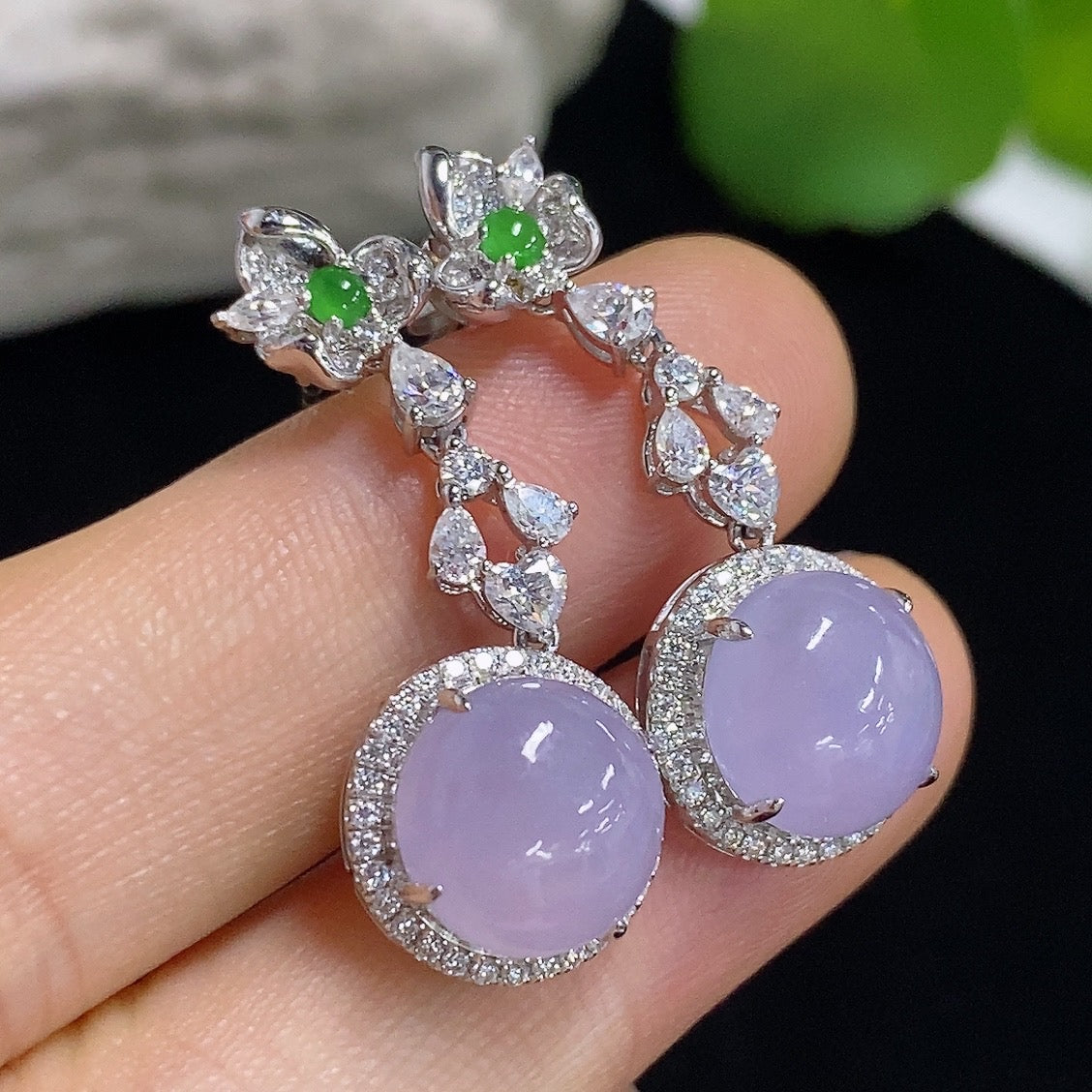 HKHQ jadeite cabochon earrings with 18K gold setting, showcasing smooth green gemstones in a stylish jewelry design