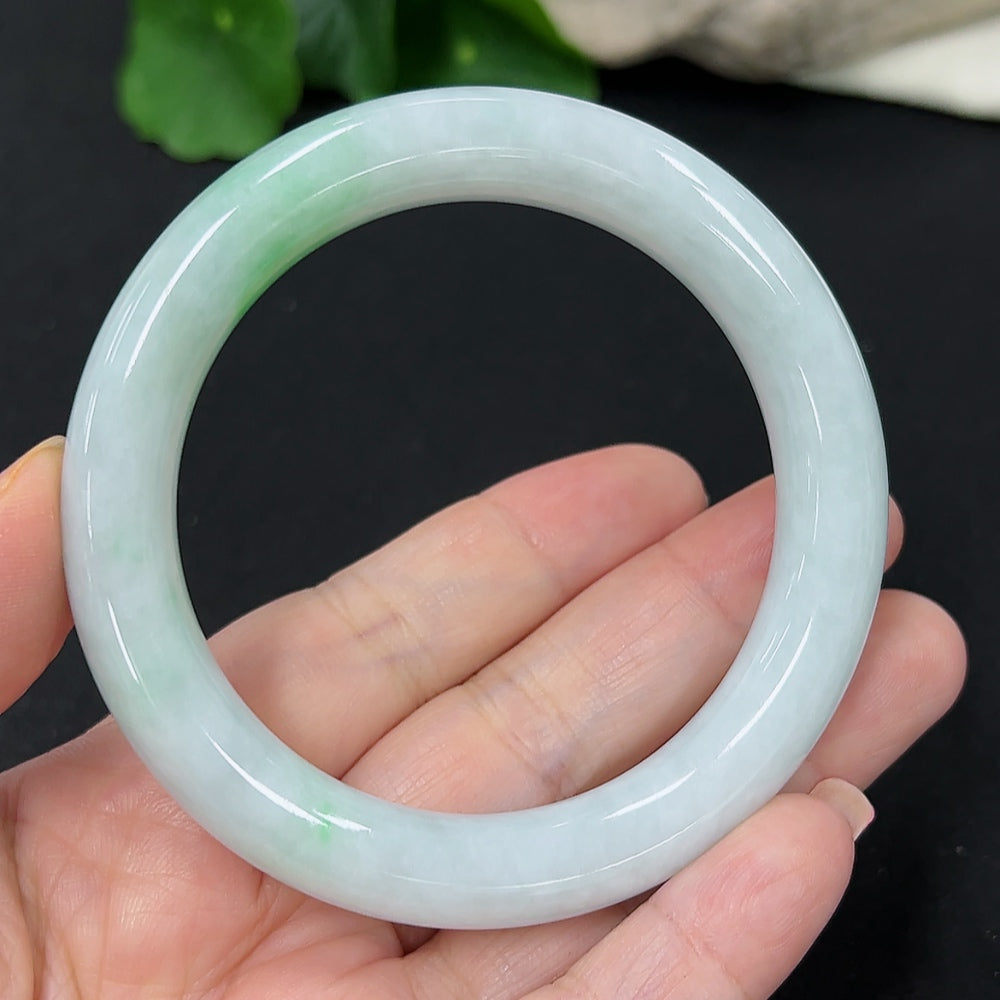 HKHQ jadeite round bangle in size 55, showcasing smooth, polished green jade with a sturdy, elegant design.