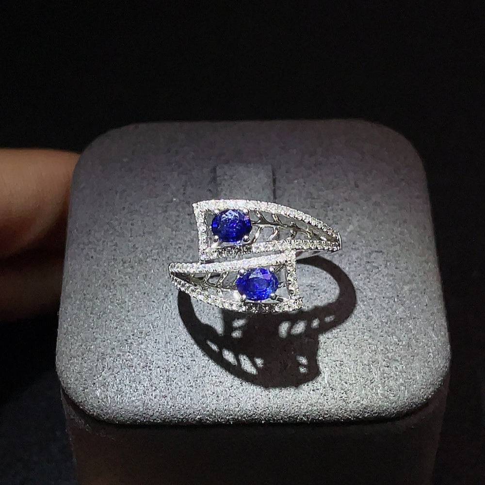 Huiliu sapphire and diamond accented gemstone ring showcasing a vibrant blue sapphire set in a elegant band.