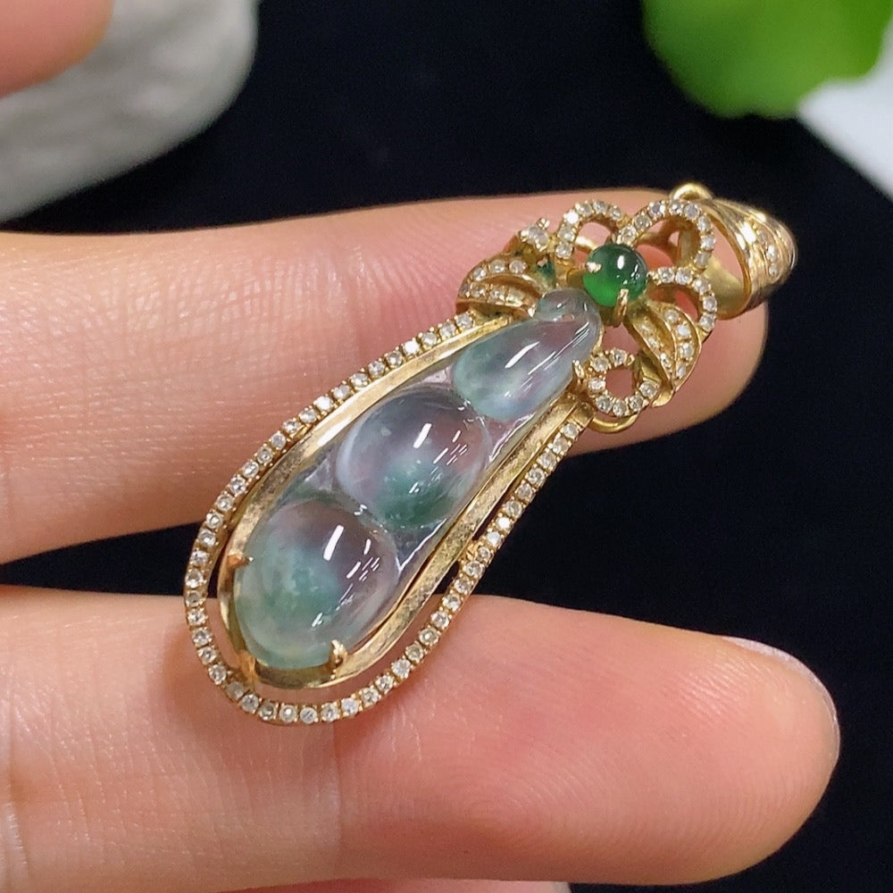 Jadeite auspicious bean pendant with 18k gold and diamond accents, weighing approximately 4.16g, in a detailed close-up image.
