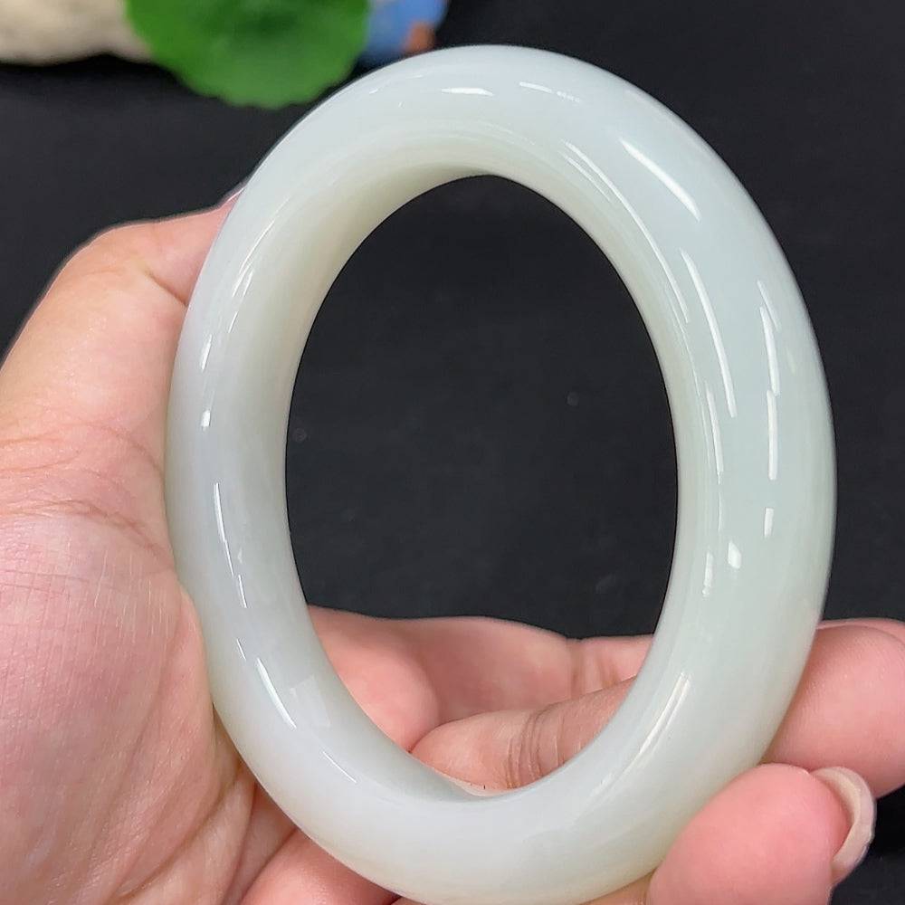 Huiliu certified Hetian jade round bracelet featuring smooth, polished green jade beads on a delicate string.
