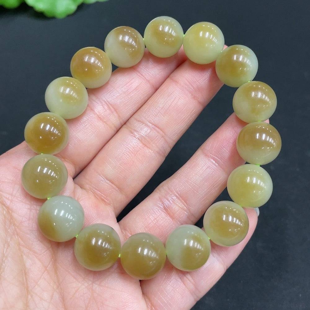 Hetian jade bracelet with 11.9mm beads and a total weight of 41.7g, crafted by HUILIU HQ, featuring smooth, polished jade stones.