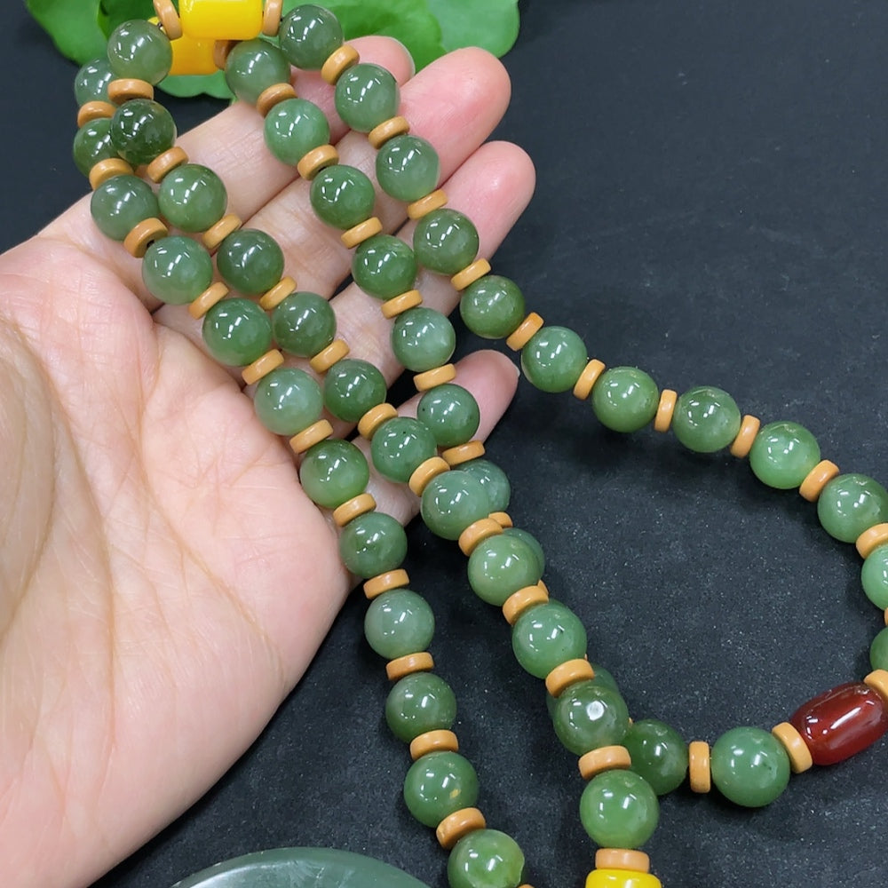 HKHQ Hetian jade pendant with Avalokitesvara design, 157.4g including chain, matching beads, crafted from high-quality jade.