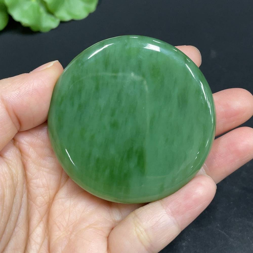 Huiliu certified Hetian jade jasper pendant featuring a Buddha carving, showcasing smooth, polished jade with intricate details.