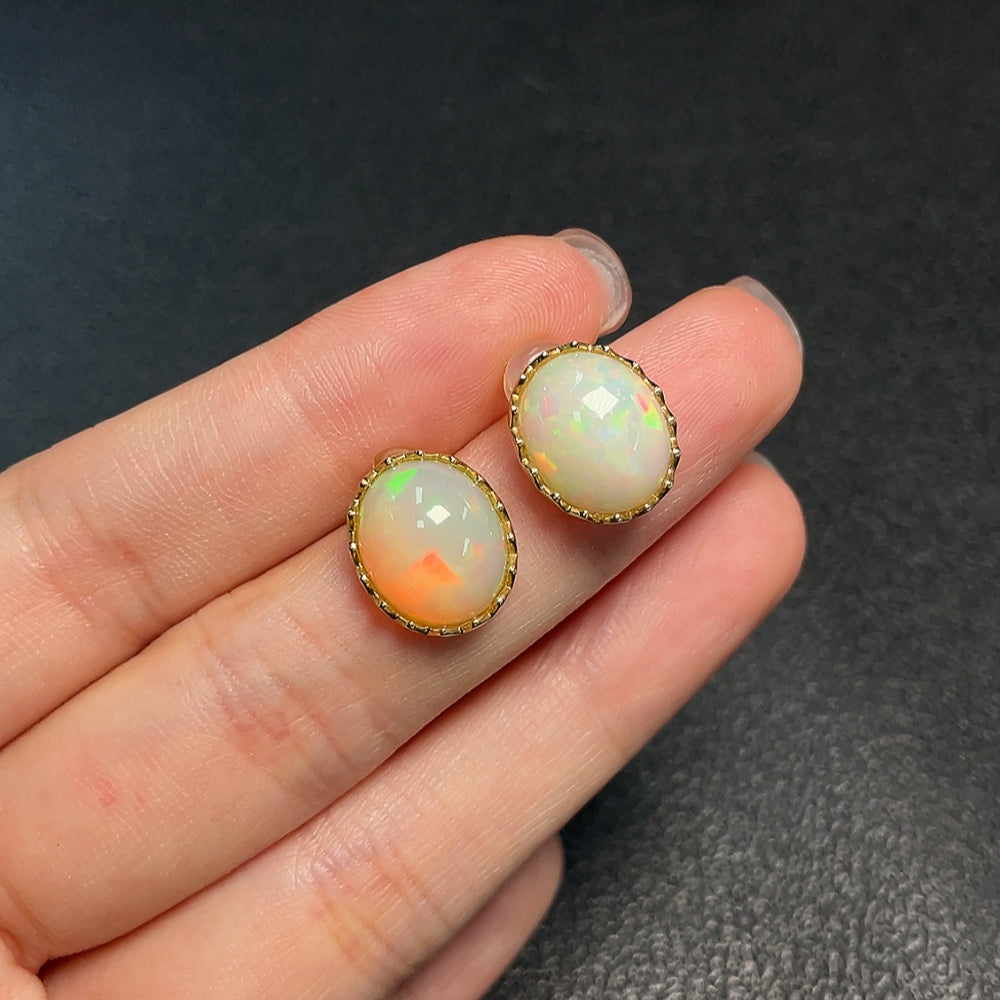 Huiliu certified opal gemstone earrings featuring vibrant, iridescent opals set in elegant jewelry design.