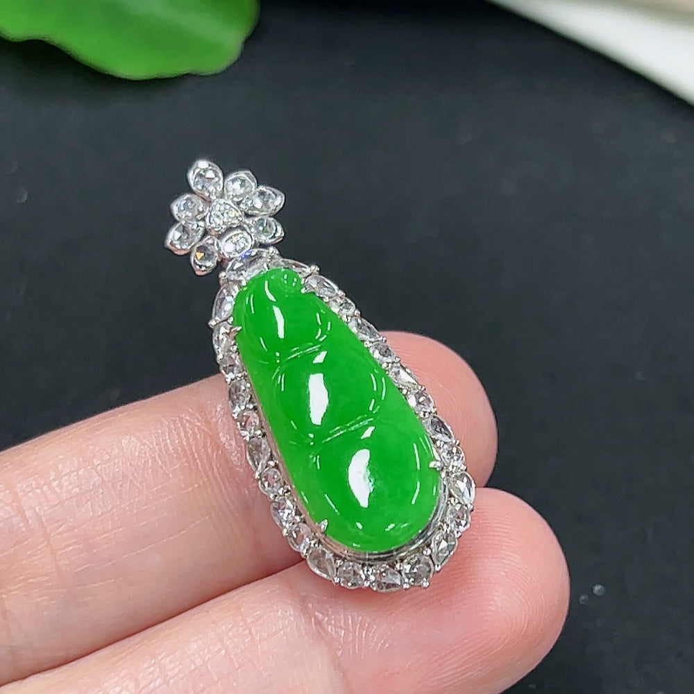 Jadeite auspicious bean pendant in 18K gold with diamond accents, showcasing smooth jade surface and intricate gold detailing.