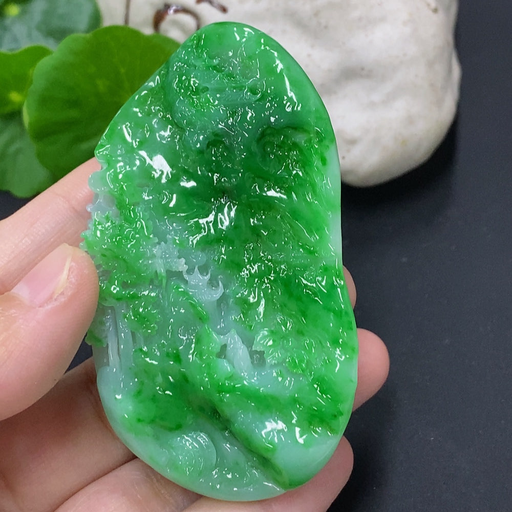 Jadeite landscape pendant by HKHQ featuring a detailed jade jade pendant with natural green and white hues, weighing approximately 65.3 grams.