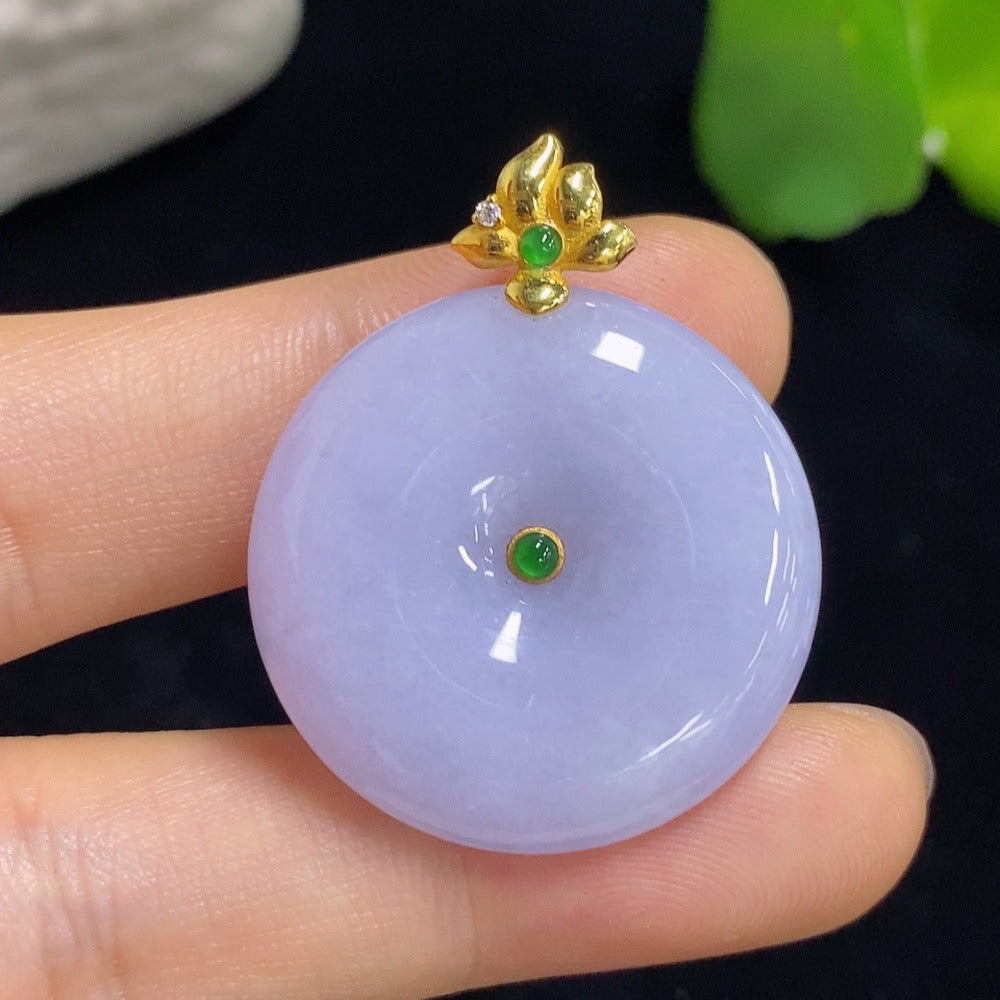Jadeite Peace Knot pendant with inlaid design on a silver chain, crafted by HKHQ, featuring a smooth, polished jadeite stone.