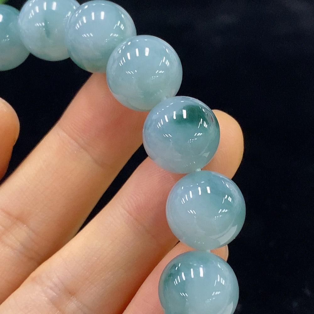 Jadeite bracelet with 12.5mm beads from HUILIU HQ, showcasing smooth, polished green jade beads with a total weight of 54.9g.