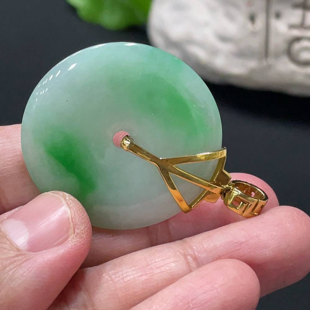 Jadeite Peace Knot pendant by HUILIU HQ with 18K gold clasp and diamond accents, showcasing intricate jade craftsmanship.