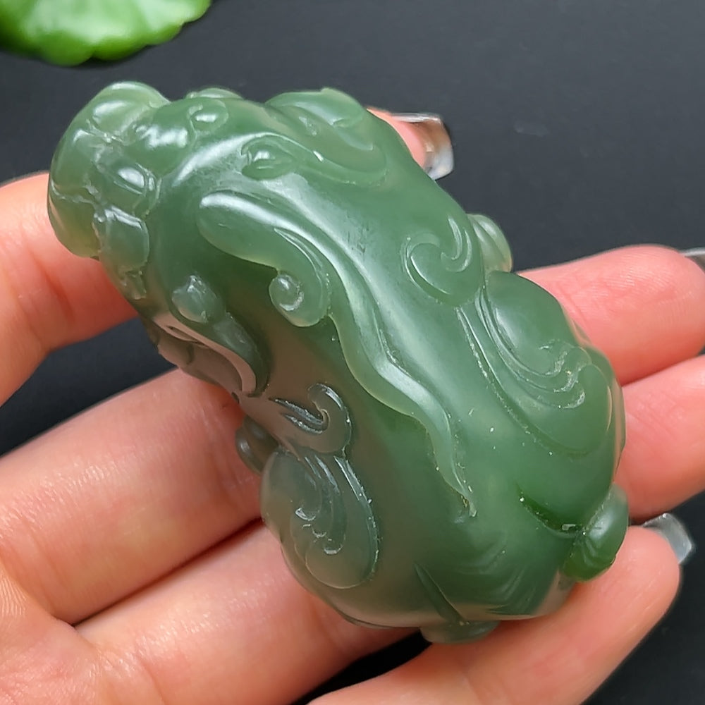 Hetian Jade Pixiu pendant necklace from HKHQ featuring a detailed carved jade Pixiu charm on a string.