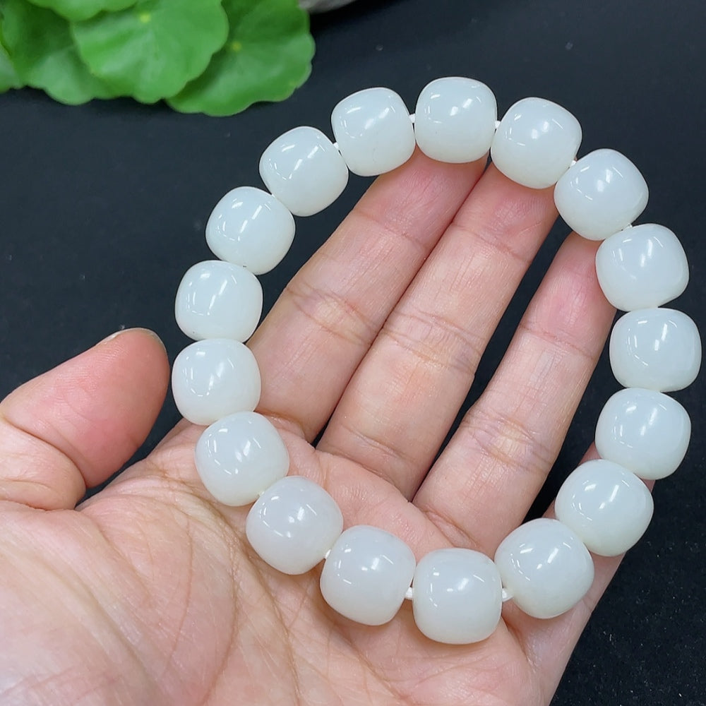 HKHQ Hetian Jade bracelet weighing 60.5g, featuring smooth, polished green jade beads on a durable string.