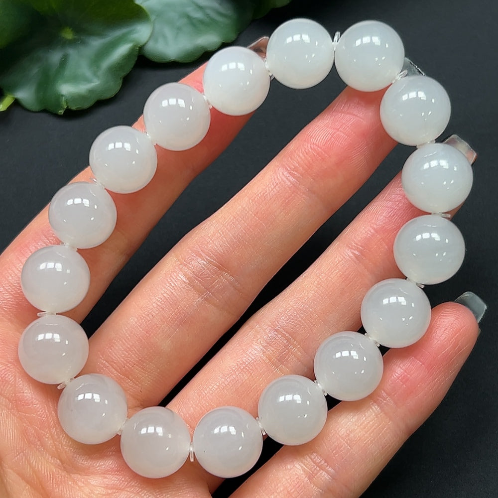 Hetian jade bracelet by HKHQ featuring 11.9mm beads and a total weight of approximately 44.52 grams, displayed on a neutral background.