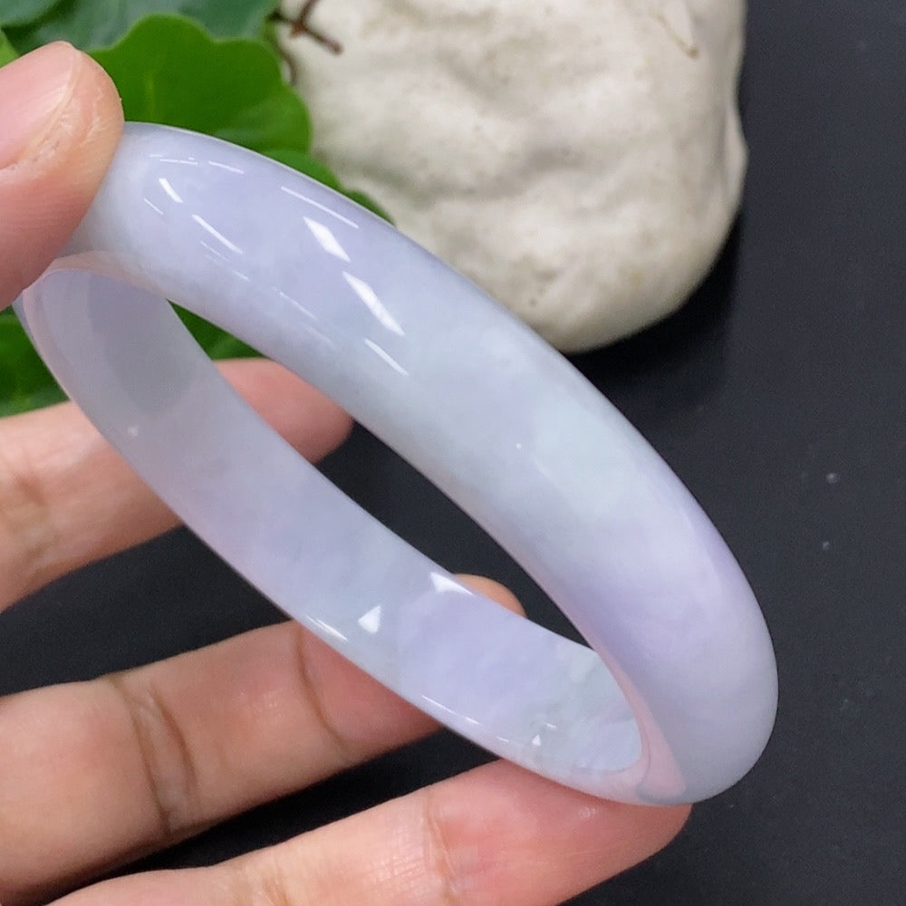 Jadeite round bangle from HKHQ, weighing approximately 54.8g, with a size of 59.7mm, featuring smooth polished jade surface.