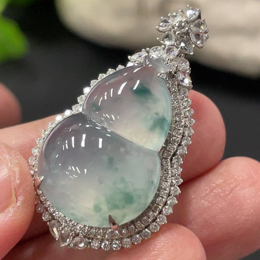 Jadeite gourd pendant by HUILIU HQ with 18K gold setting and small diamond accents, showcasing polished green jade and delicate craftsmanship.