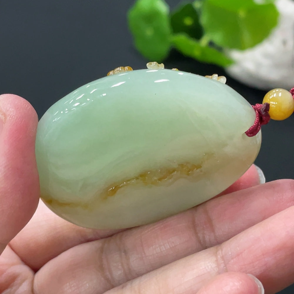 Huiliu Jadeite deer pendant featuring a detailed green jade carving, showcasing craftsmanship and natural stone beauty.