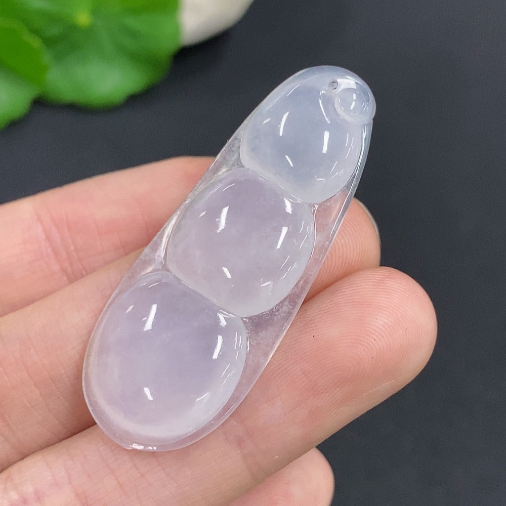 Jadeite Lucky Bean pendant with natural green jade, crafted by HUILIU HQ, showing detailed carved bean shape and smooth surface.