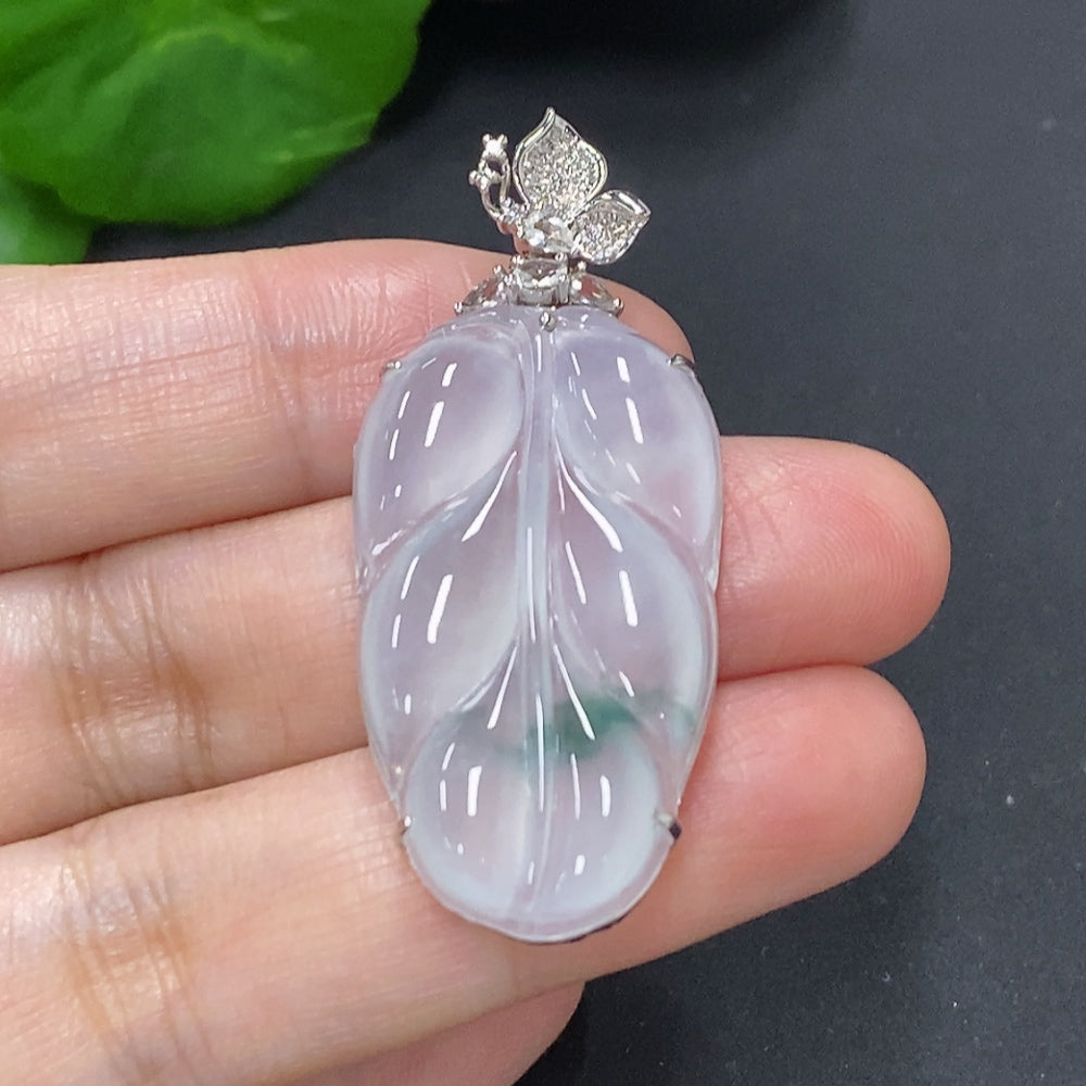 Jadeite leaf pendant necklace by HKHQ with 18K gold and diamond accents, featuring a detailed green jade leaf design.