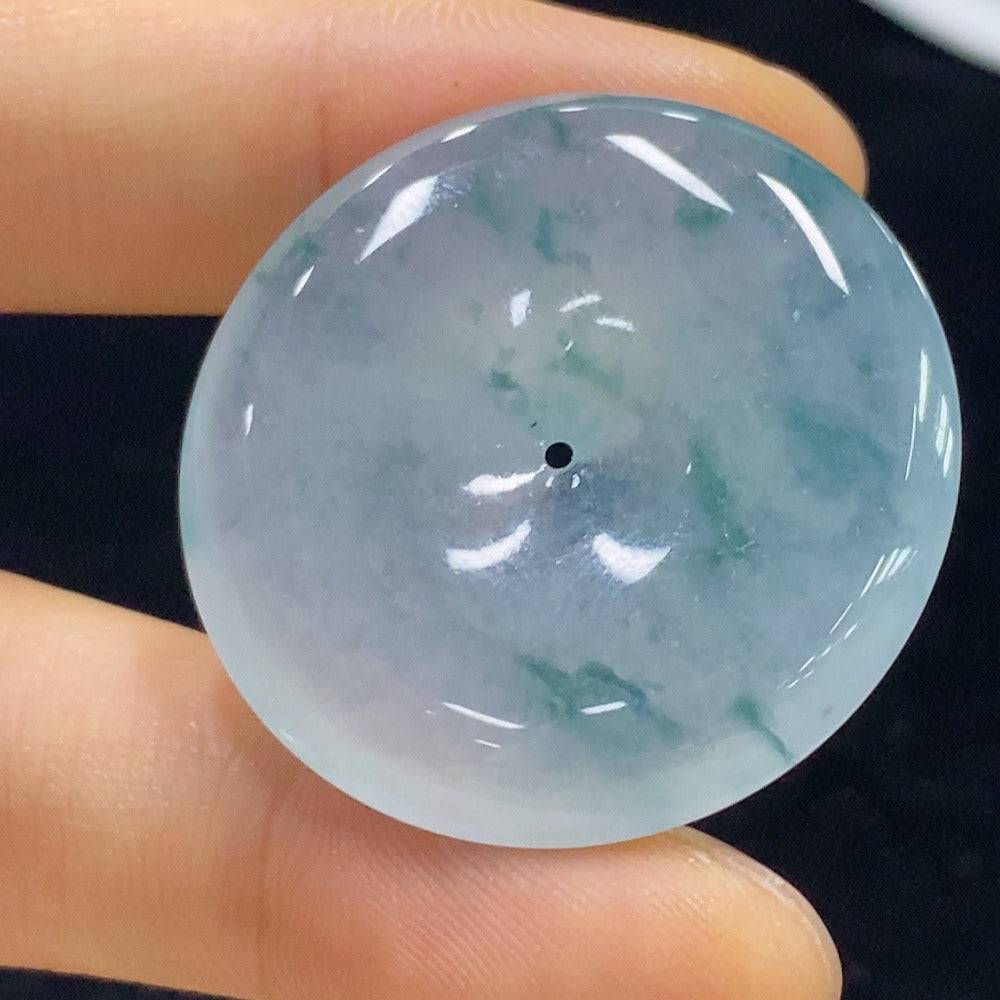 Jadeite Peace Knot pendant from HUILIU HQ, showcasing intricate design and smooth jade surface, weighs approximately 12.82 grams.