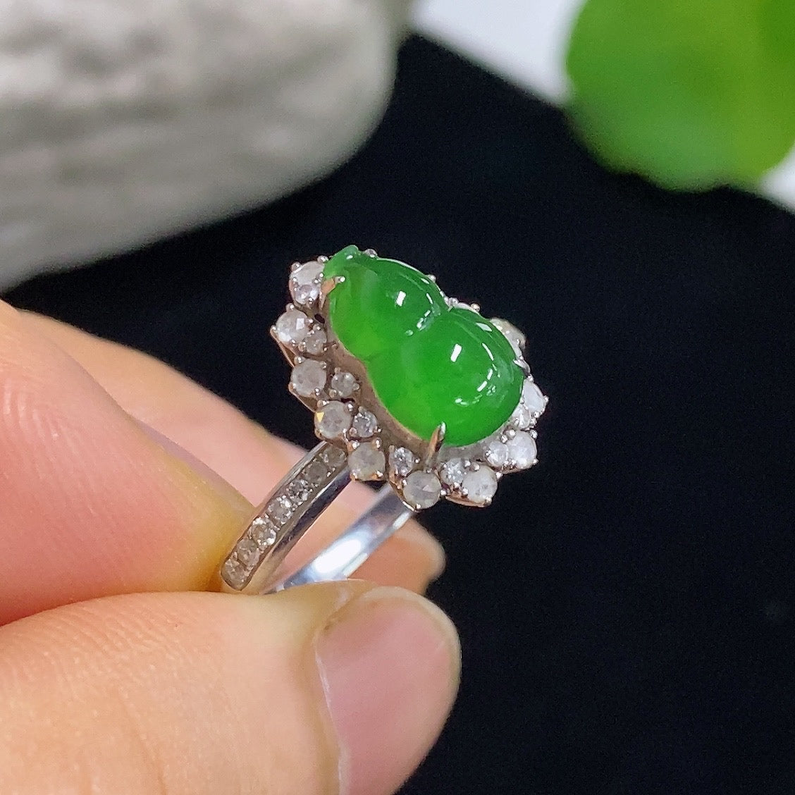 Jadeite gourd inlay ring by HKHQ featuring 18K gold and diamond accents, showcasing intricate design and polished finish.