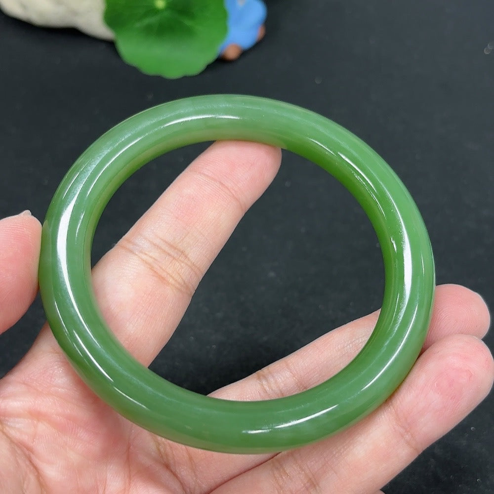 HKHQ Hetian Jade round bangle, size 60, 53.1g, showcasing smooth polished surface and rich green jade color.