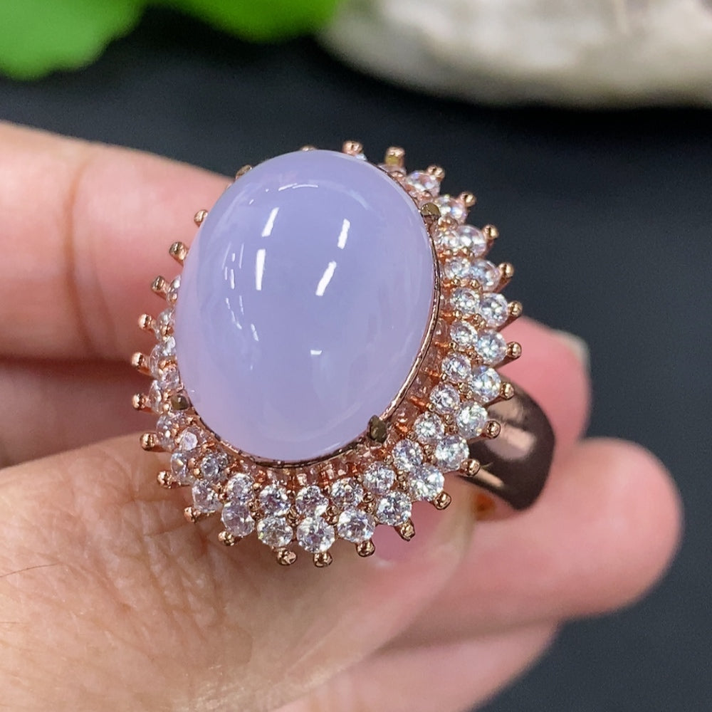 Jadeite cabochon with non-gold inlay, weighing approximately 20.8g, from HKHQ, showcasing smooth, polished jade gemstone.
