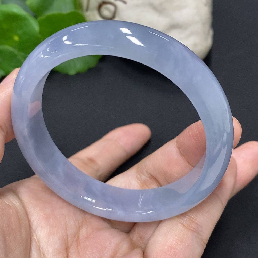 HUILIU HQ jadeite round bangle, size 57.3, weighs approx. 56.3g, showcasing smooth, polished green jade surface.
