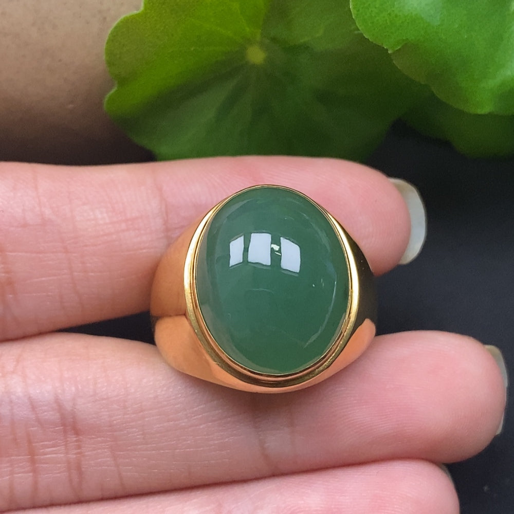 Elegant jadeite ring with 18k gold setting from HKHQ, showcasing a smooth, polished green gemstone design.