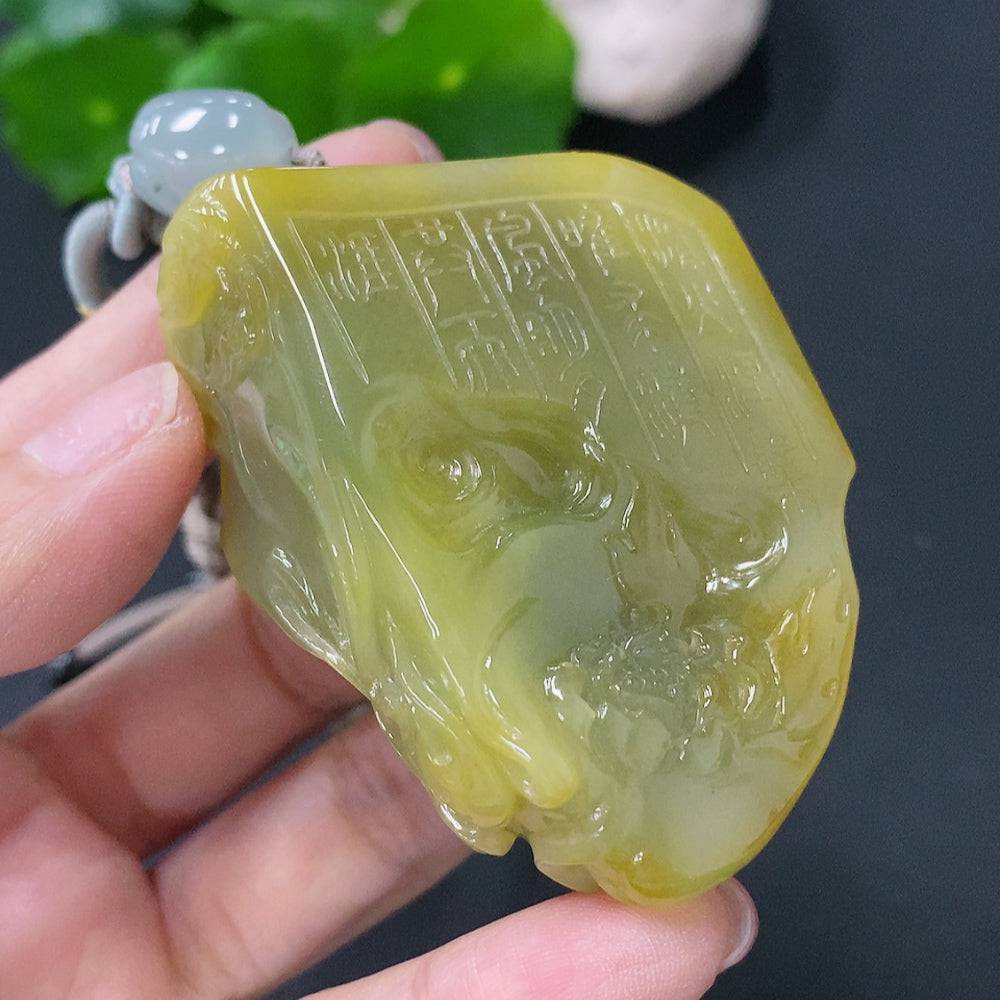 Jadeite pendant featuring a phoenix design in green jade, weighing approximately 81g with rope, from HUILIU HQ.