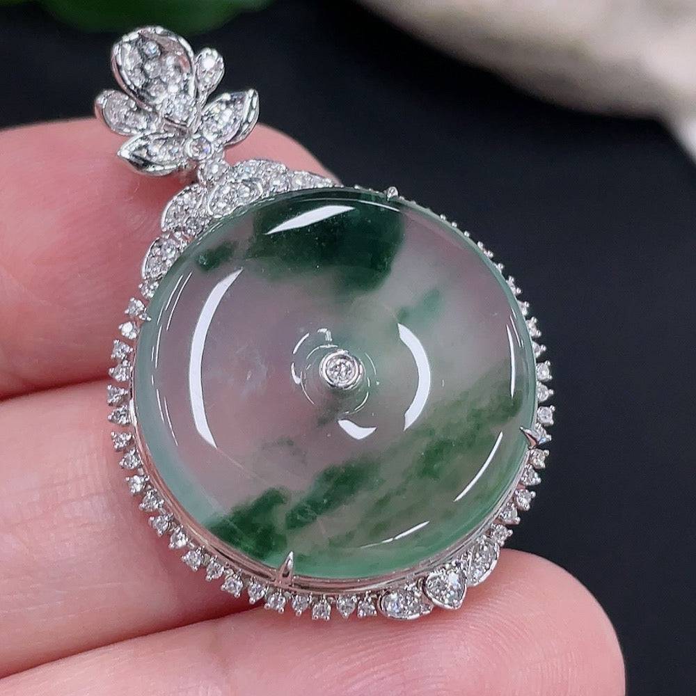 Jadeite Peace Knot pendant by HUILIU HQ with 18K gold accents and diamond details, showcasing intricate craftsmanship.