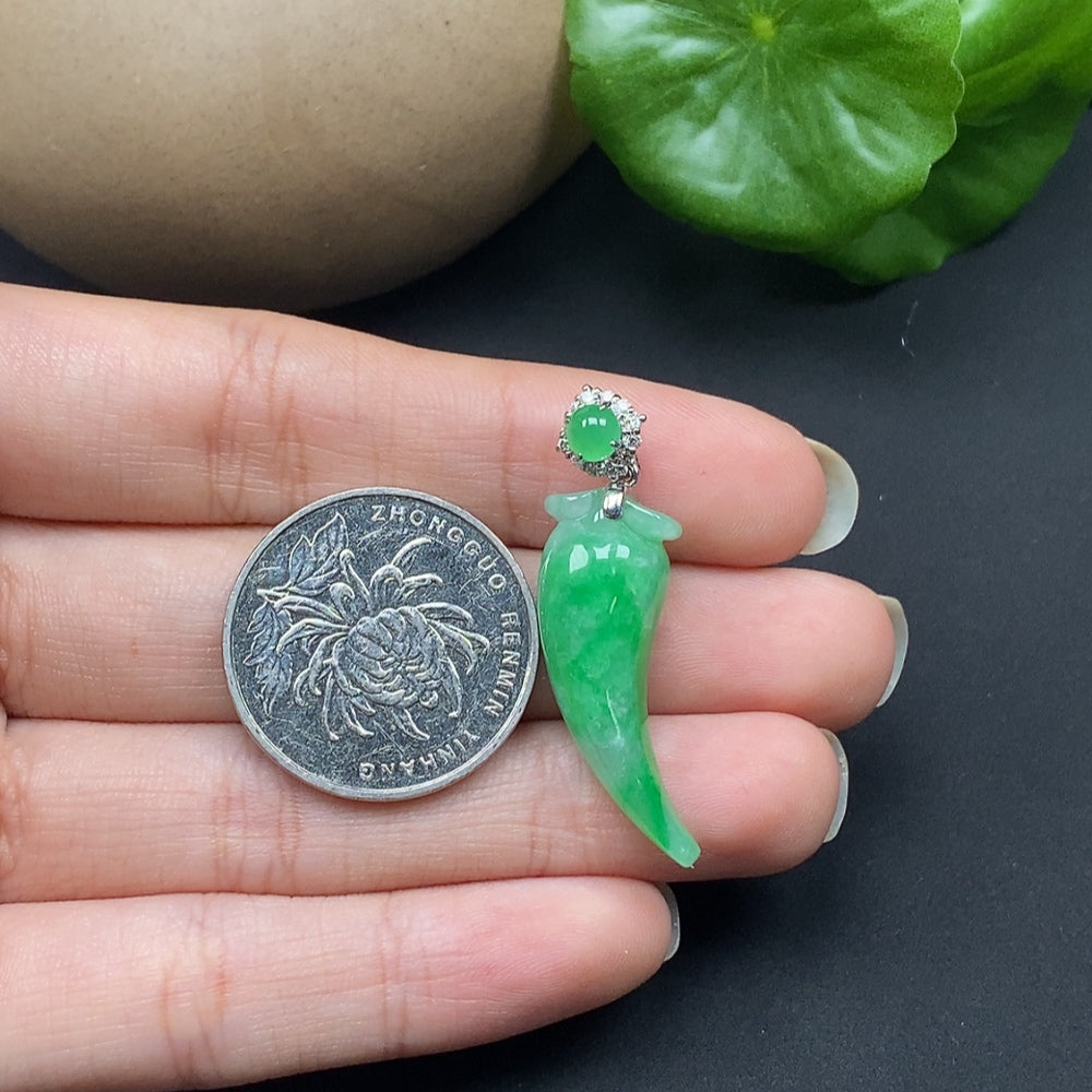 Jadeite pendant featuring a chili design with diamond accents, set in 18K gold, displayed on a necklace chain.