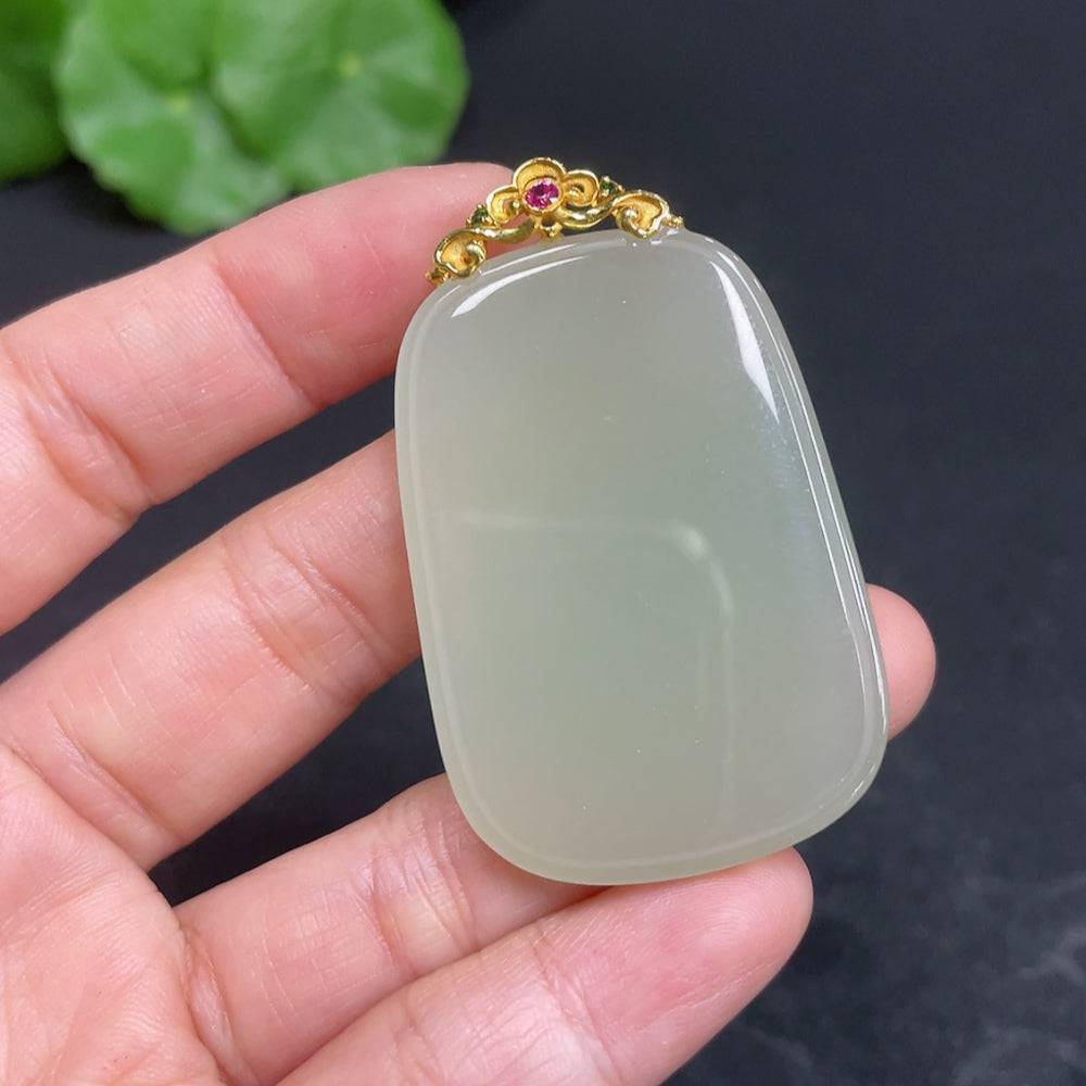 Huiliu Certified Hetian jade pendant with plain design and clasp, showcasing smooth, polished green jade stone.