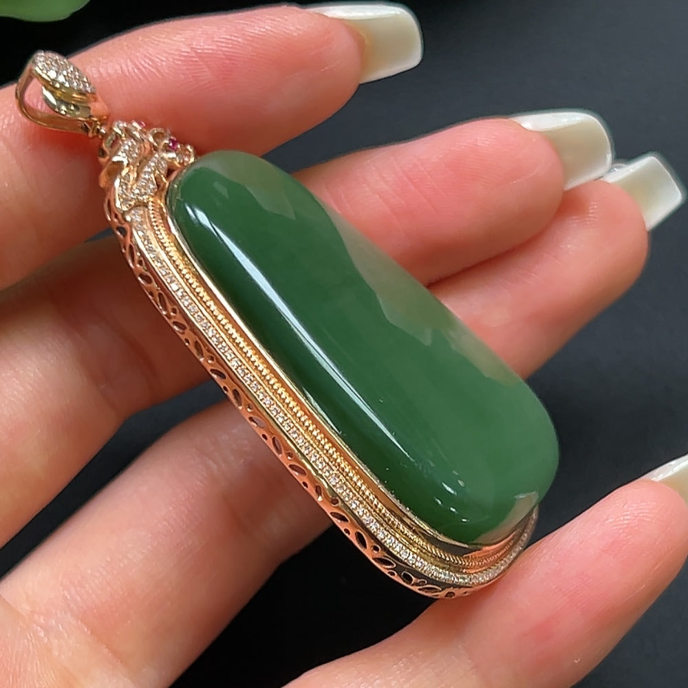 Hetian jade plain pendant with 18K gold and diamond inlay on a necklace, featuring elegant craftsmanship and natural jade color.