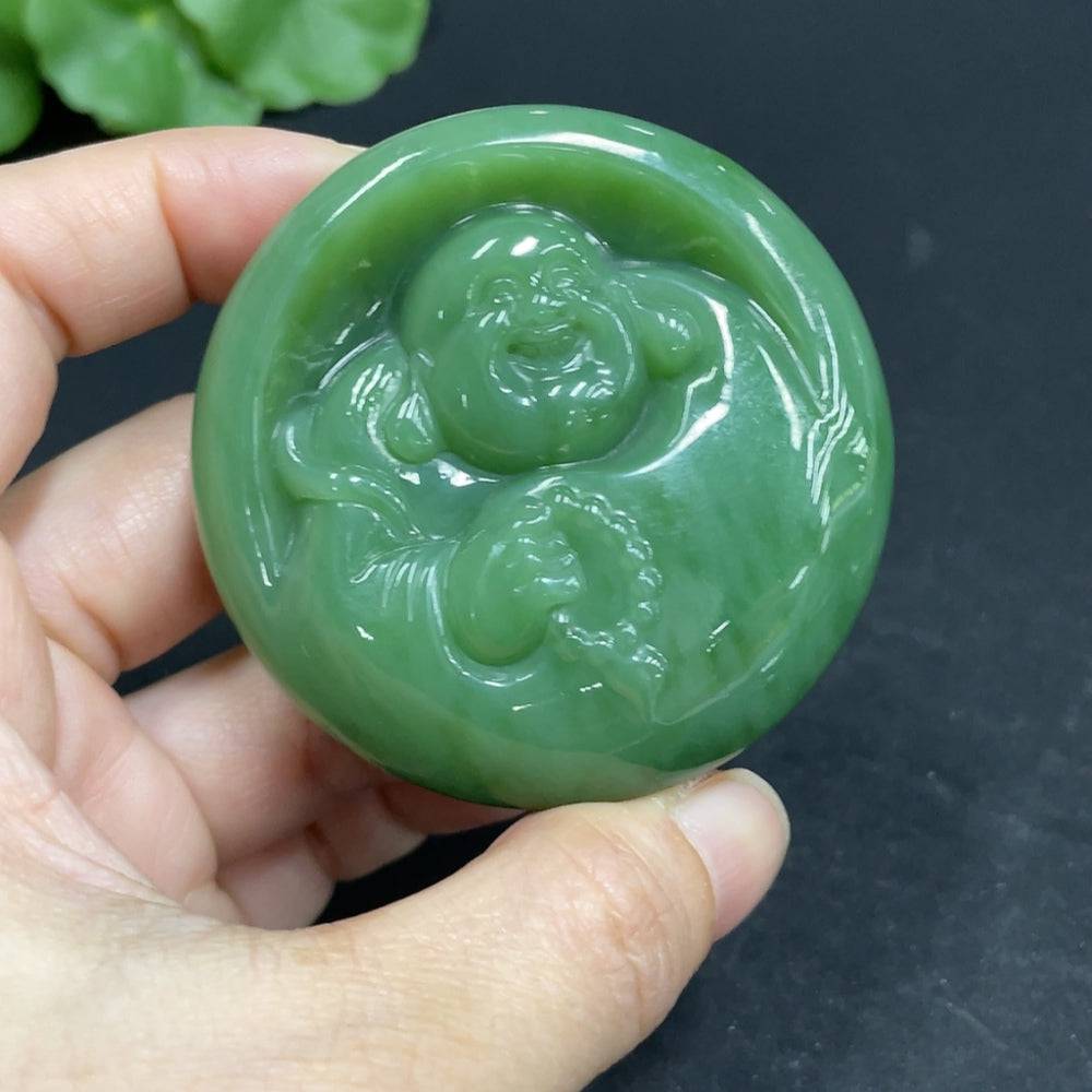 Huiliu HQ Hetian Jade Jasper pendant featuring a carved Buddha figure, polished smooth, with natural jade coloration and intricate details.