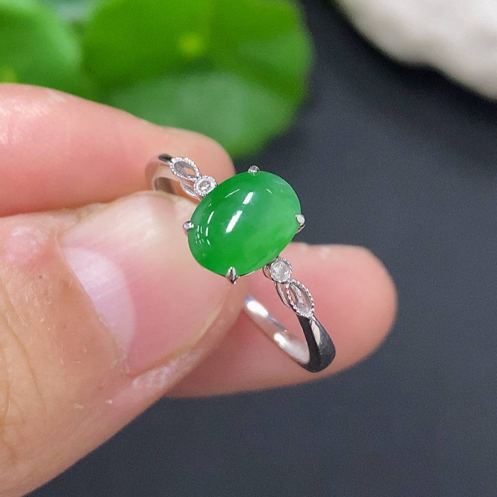 Jadeite cabochon ring with diamond accents in 18K gold, size 16, featuring a smooth green jade stone and delicate gold band.