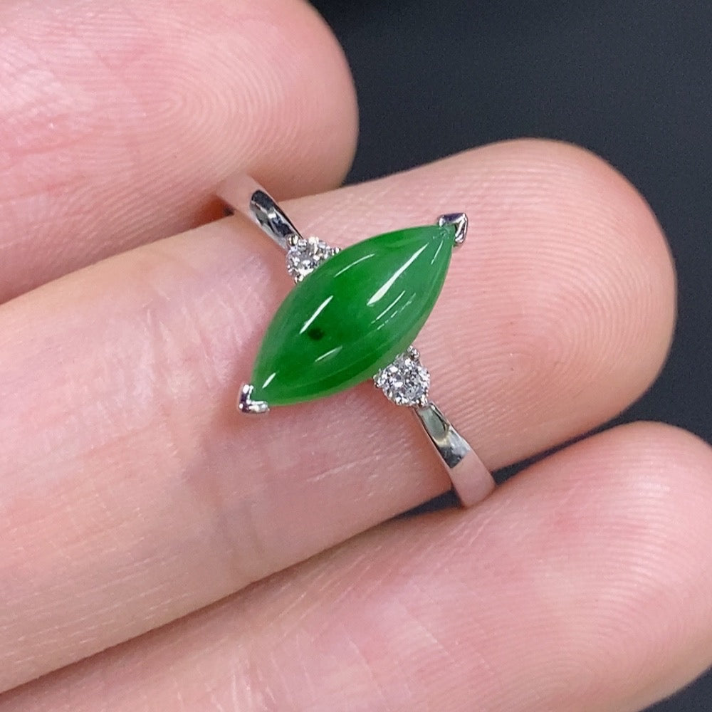 Jadeite freeform ring by HKHQ in 18K gold with diamond accents, featuring a unique, organic-shaped design.
