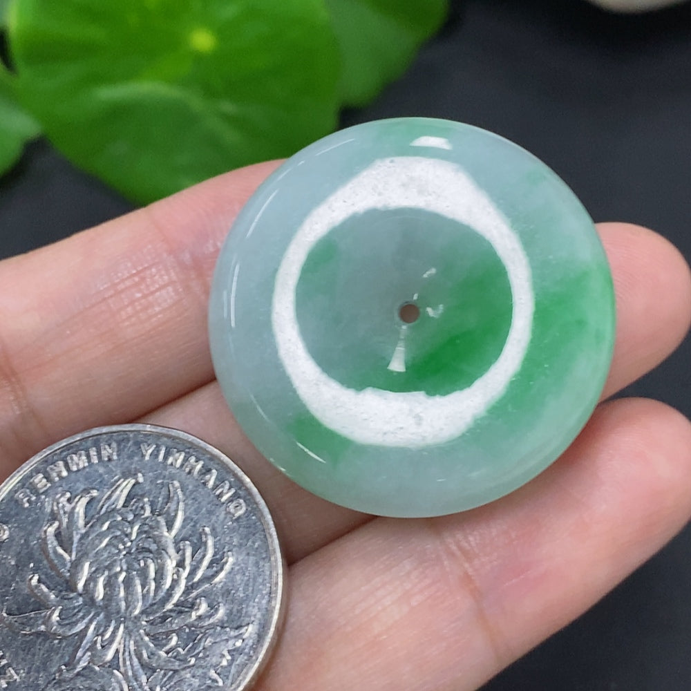 Jadeite safety buckle from HKHQ, approximately 11.7g, showcasing smooth green jade with polished finish.