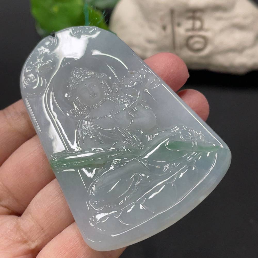 Jadeite Guanyin pendant from HUILIU HQ featuring a detailed carved figure, weighing approximately 51.47 grams.