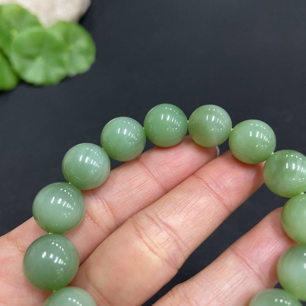 Huiliu Hetian Jade Jasper bracelet with 11.8mm beads, featuring smooth, polished jade stones on a jewelry strand.