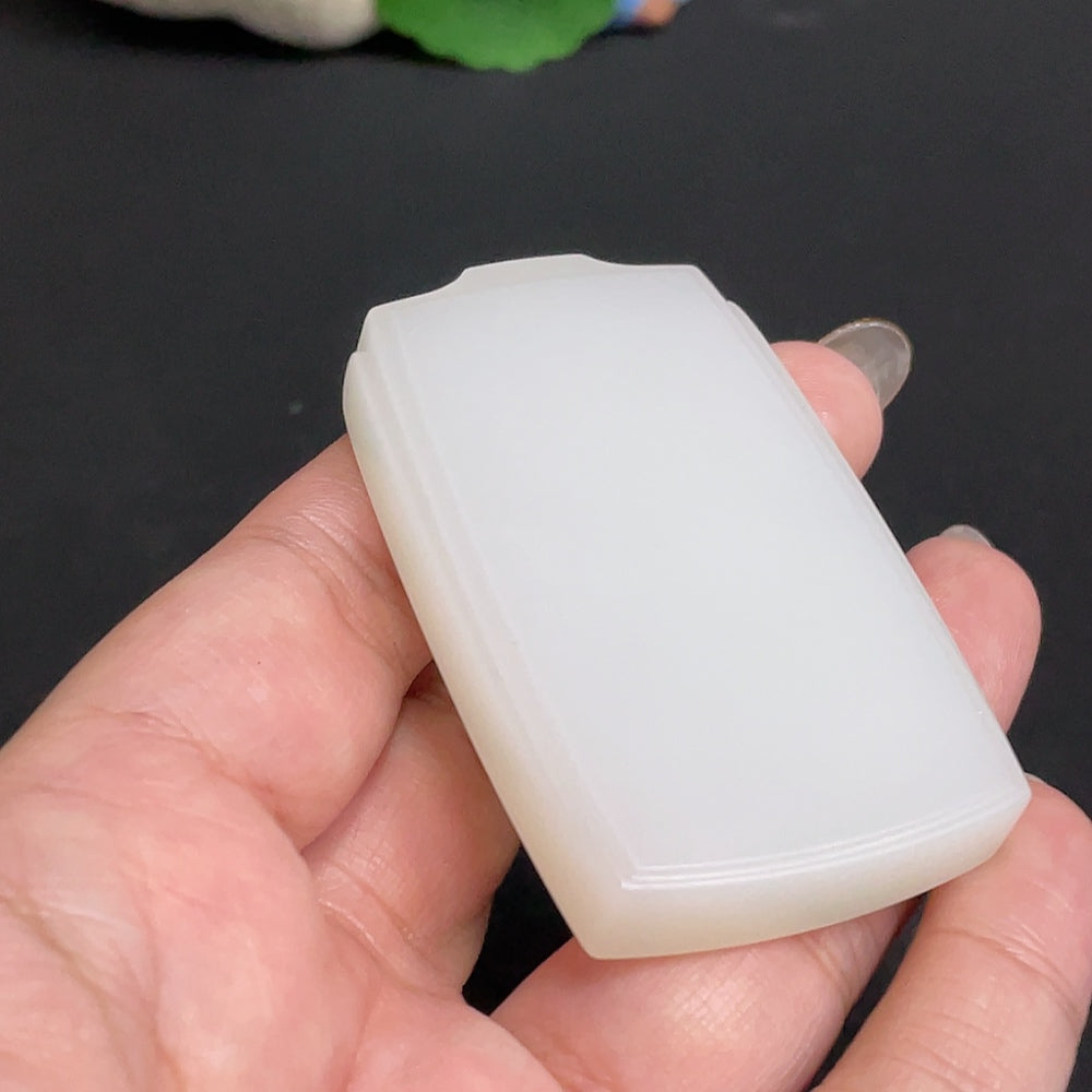 Huiliu certified Hetian jade plain pendant with smooth, polished surface, showcasing elegant, natural jade craftsmanship.