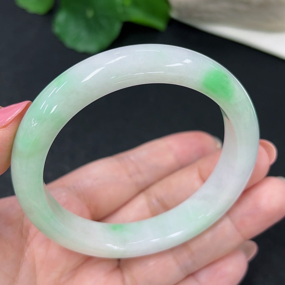 HKHQ jadeite round bangle, size 56, 51.3g, smooth green jade bracelet with polished finish on a plain background.