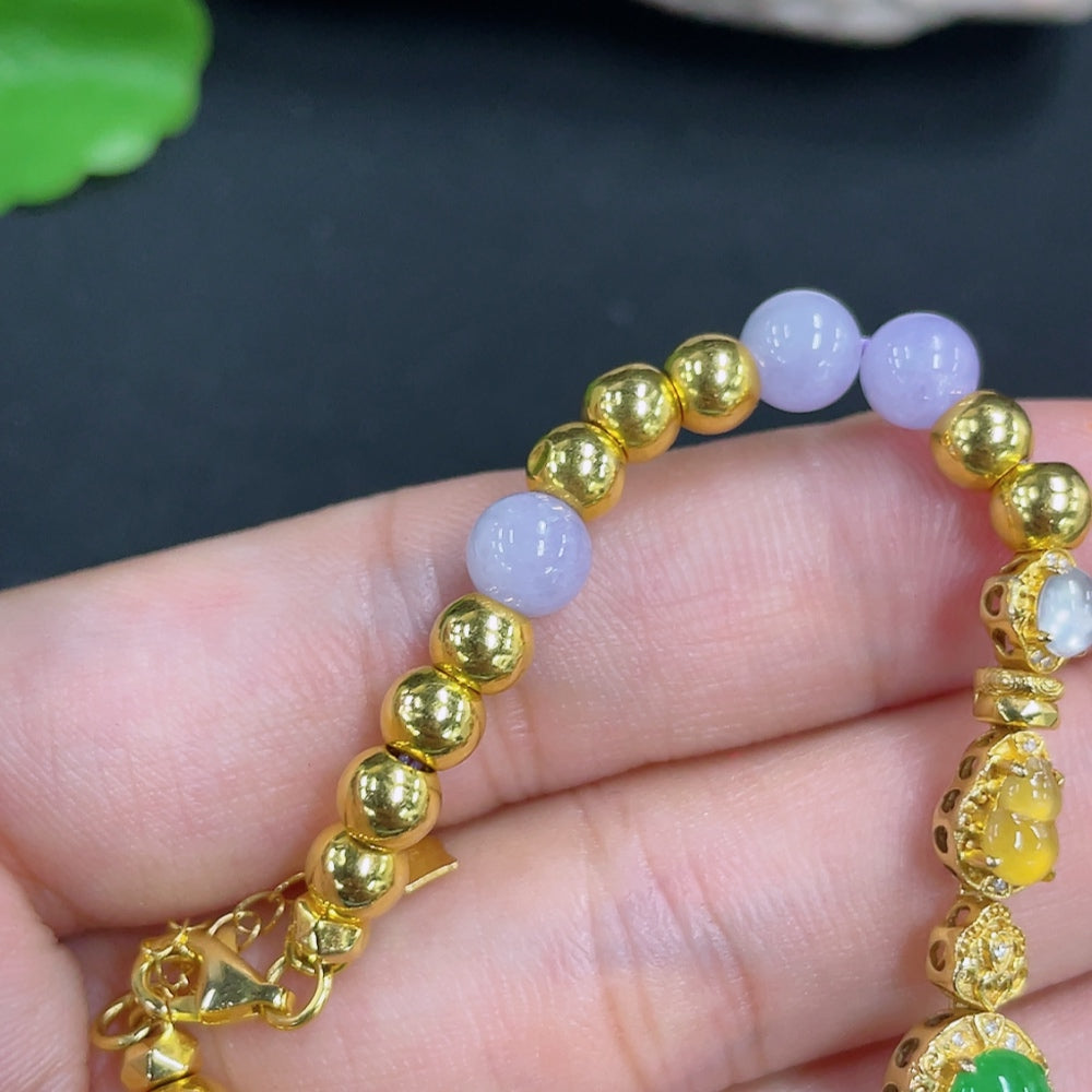 Jadeite bead bracelet with mixed gold components, featuring smooth green jade beads and gold accents, by HKHQ.