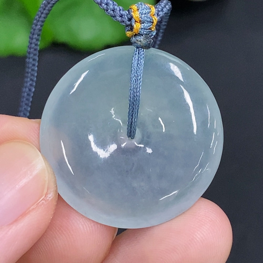 Jadeite safety pendant necklace by HKHQ featuring a smooth, polished jadeite gemstone on a delicate chain.