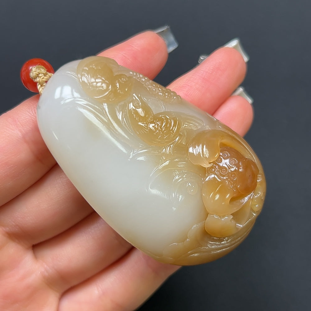 Hetian Jade "Joy on the Brow" pendant necklace with non-Hetian beads, featuring intricate design and polished jade craftsmanship.