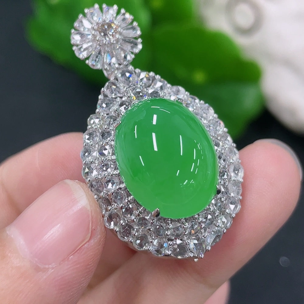 Jadeite inlaid cabochon pendant with 18K gold and diamond accents, elegant necklace featuring a polished gemstone and intricate details.