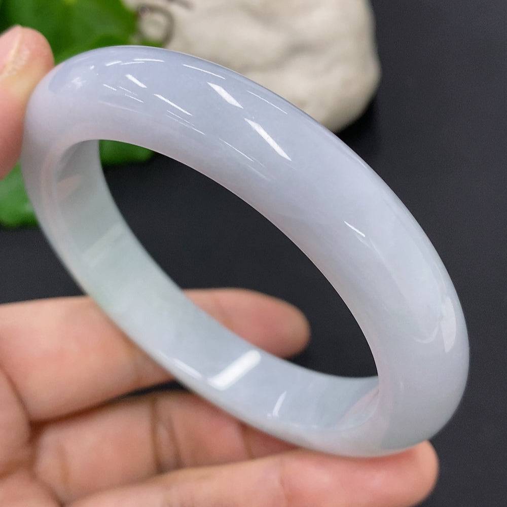 HUILIU HQ jadeite round bangle in size 56, weighing approximately 63.1g, featuring smooth, polished jade surface and circular design.