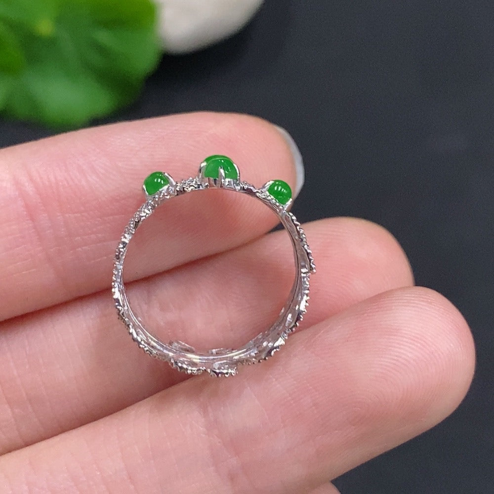 Jadeite cabochon solitaire ring in 18K gold with a size 9 band, featuring a polished green jade stone and delicate gold setting.